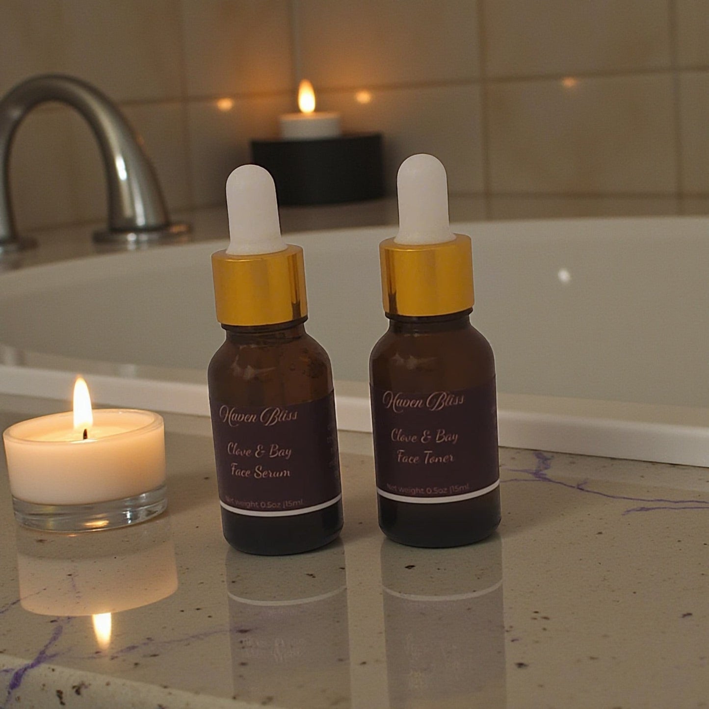 Haven Bliss Skincare Clove & Bay Ritual Duo, two 15ml amber glass bottles with droppers, one serum, one toner, beside a lit candle.